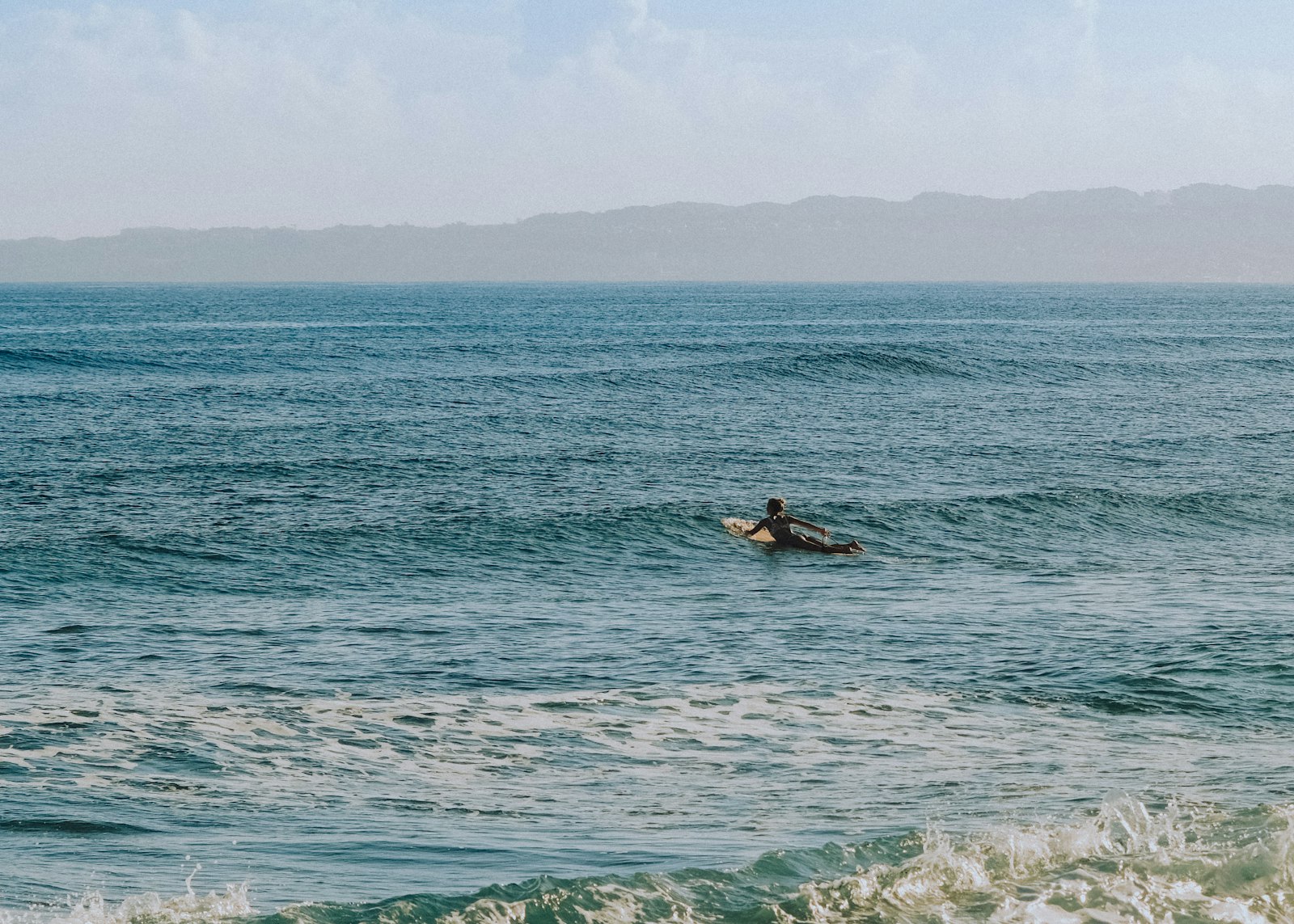 Surfer waiting for a wave in Rincon, Puerto Rico